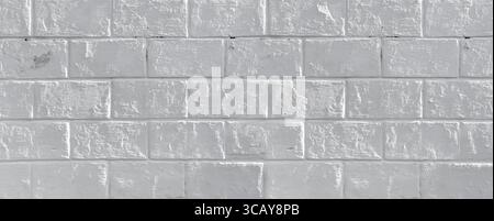 White painted brick wall providing a textured and seamless backdrop Stock Photo