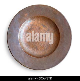 Antique hammered copper plate isolated on white background, showing beautiful green and brown patina Stock Photo