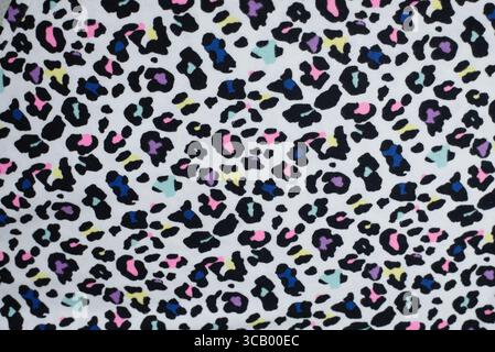 A lively and vibrant leopard-inspired pattern featuring colorful abstract spots on a white canvas, offering a playful and modern aesthetic Stock Photo