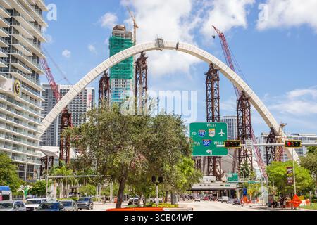 Miami Florida,Biscayne Boulevard,I-395 Signature Bridge The Fountain,arches arch under construction project,steel support columns,cranes lifting mater Stock Photo