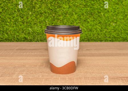 Comforting simplicity: a coffee with milk served in a white cup, highlighting the contrast between the dark liquid and the golden foam Stock Photo