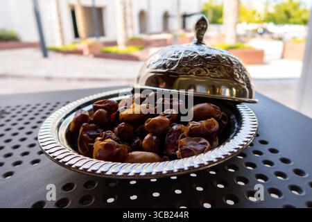 Omani dried dates on a silver tray. Stock Photo