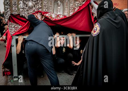 April 7, 2023, Badalona, Barcelona, Spain: Costaleros are seen during a break of the Good Friday procession held in the Badalona district of Llefia, Barcelona Province, during Holy Week celebrations. (Credit Image: © Jordi Boixareu/ZUMA Press Wire) Stock Photo