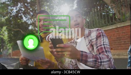 Consulting two students comparing directions on map and phone on sunlit sidewalk, with headphones Stock Photo