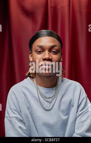 Portrait of Black Man Looking Confidently into Camera at Talent Competition Stock Photo