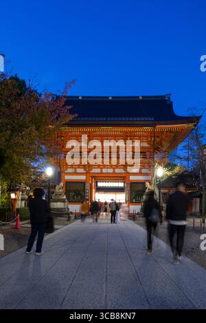 Illuminated South Tower Gate at Yasaka Shrine in the evening with ...