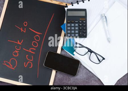 A blackboard displaying the words back to school clearly written on it Stock Photo