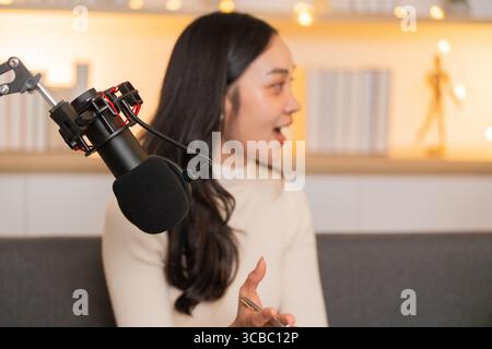 Podcast Discussion. Engaging conversation between two women in a cozy studio setting. Stock Photo