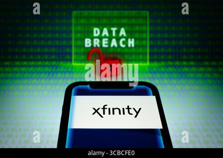December 19, 2023, Asuncion, Paraguay: Xfinity logo is displayed on a smartphone in front of the words ''data breach'', visual representation of open lock and binary code digits. Philadelphia - Comcast is notifying Xfinity customers of a ''data security incident'' it says that the information in scope included customers names, contact information, partial social security numbers, usernames and passwords, and more. In a notice on Monday, Xfinity said ''there was unauthorized access'' to some of its internal systems between October 16 and October 19, 2023. (Credit Image: © Andre M. Chang/ZUMA Pr Stock Photo