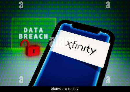 December 19, 2023, Asuncion, Paraguay: Xfinity logo is displayed on a smartphone in front of the words ''data breach'', visual representation of open lock and binary code digits. Philadelphia - Comcast is notifying Xfinity customers of a ''data security incident'' it says that the information in scope included customers names, contact information, partial social security numbers, usernames and passwords, and more. In a notice on Monday, Xfinity said ''there was unauthorized access'' to some of its internal systems between October 16 and October 19, 2023. (Credit Image: © Andre M. Chang/ZUMA Pr Stock Photo