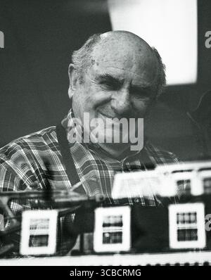 Elderly shoemaker Chvistis Soillis smiling in workshop Stock Photo