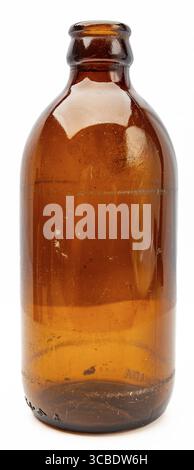 Vintage brown short beer bottle against white background Stock Photo