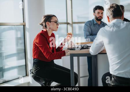 Multicultural business employees having a casual lunch meeting Stock Photo