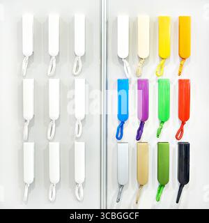 Colored handsets of intercom on display in a store Stock Photo