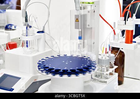 Oven autosampler and coulometric titrator in lab Stock Photo