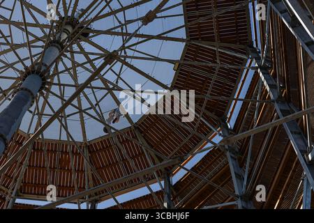 Metallic structure of observation tower with wooden platforms and support beams, designed for panoramic views in tourist areas Stock Photo