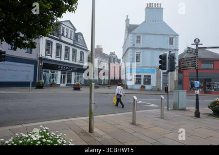 A peaceful, quiet street in the town centre of Stornoway, Isle of Lewis, evokes the calm atmosphere of Scottish island life. Stock Photo