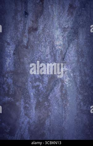a dark blue background of a cement wall. Stock Photo