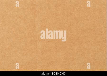 Texture features smooth brown craft paper surface ideal for arts, crafts, and design projects, enhancing creative expression. Stock Photo