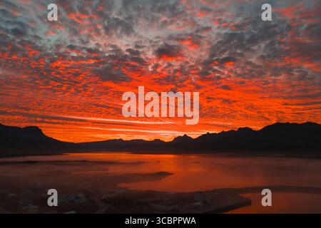Aerial View of Sunset Over Icelandic Landscape With Mountains and Water Stock Photo