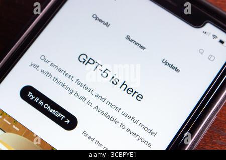 Close-up of a smartphone displaying the GPT-5 release announcement on the OpenAI website, highlighting its advanced AI capabilities and availability. Stock Photo