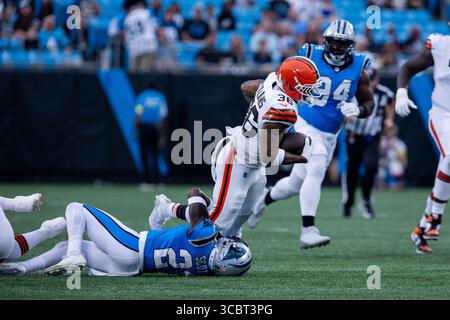 Carolina Panthers safety Nick Scott (21) tackles New Orleans Saints