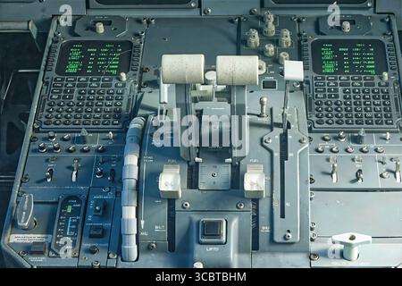Amsterdam, netherlands, july 10,2025, close up view of a fokker 100 cockpit featuring thrust levers, control buttons, digital screens, and intricate i Stock Photo