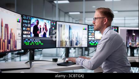 Young Caucasian Man Editing Graphic Video Using Advanced Desktop Software. Stock Photo