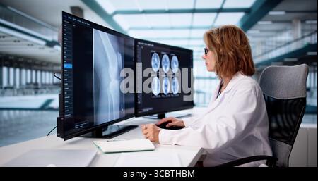 Older Radiologist Analyzing Neuro Images On Computer, Collaborating With Team. Stock Photo