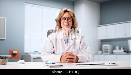 Senior Physician Leads Virtual Healthcare Webinar On Telemedicine Trends Stock Photo