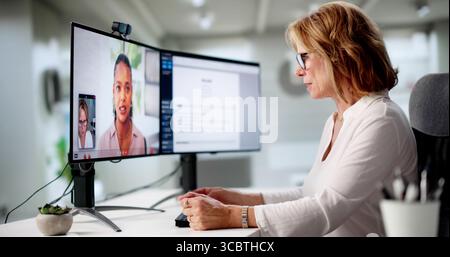 Senior Woman Working From Home In Virtual Job Interview Webinar. Stock Photo