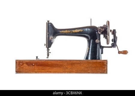 Old vintage sewing machine isolated on white background. Stock Photo