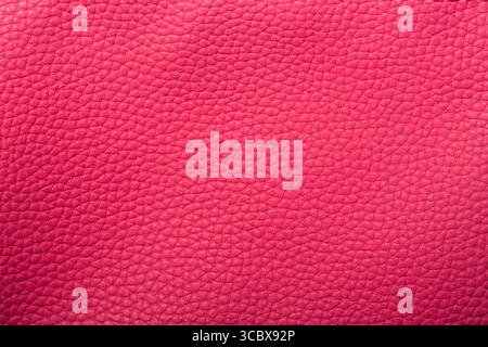 Pink red textured leather background. Abstract leather texture. Stock Photo