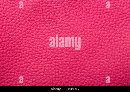 Pink red textured leather background. Abstract leather texture. Stock Photo
