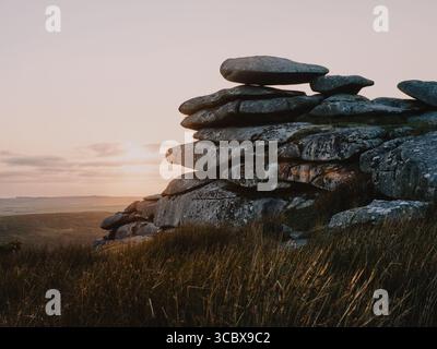 Sunset over the granite tor on Stowes Hill, Minions, Bodmin Moor, Cornwall England UK Stock Photo