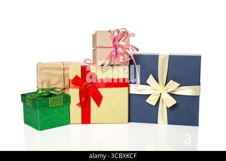 Colorful stacked gift boxes for New Year or Christmas isolated on white background. Stock Photo