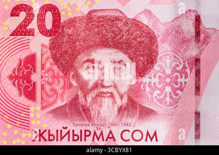 Close up image of Kyrgyz Republic currency. 20 Som banknote with Togolok Moldo Kyrgyz poet portrait. Stock Photo