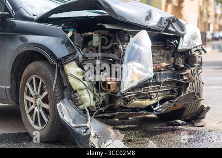 Destroyed crashed car outdoors after car crash traffic accident. Car insurance concept. Stock Photo
