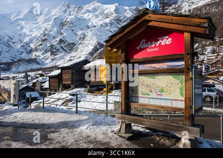 Large map of Saas-Fee with tourist information in ornate wooded frame