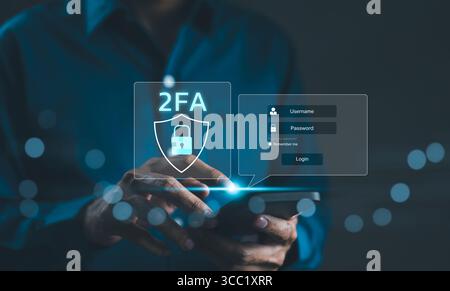 Privacy protect data and cyber security concepts. The two factor authentication on smartphone screen displays 2FA. Data protection with 2FA increases Stock Photo
