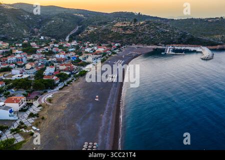 Agia Anna Evia, Greece – June 22, 2025: The beach of Agia Anna on Evia’s northeast coast features sunbeds, umbrellas, and a lifeguard tower under clea Stock Photo