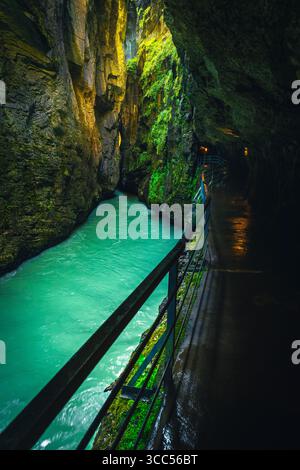 Fantastic footpath with tunnels in the Aare gorge. Stunning viewpoint with mountain river in the deep gorge, Meiringen, Switzerland, Europe Stock Photo