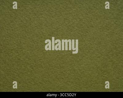 The texture of this olive green paper surface captures the essence of nature's own canvas Stock Photo