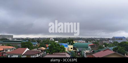 Clouds Over Houses Stock Photo