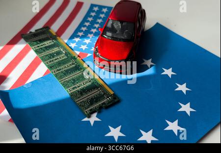 toy car model and microcircuit chip flag of the USA and the European Union Stock Photo