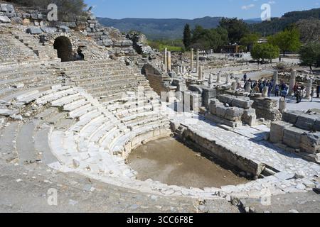Ancient stone amphitheatre with steps surrounded by ruins in a historical site, theatre, Efes, Ephesus, Ephesus, UNESCO World Heritage Site, Izmir Pro Stock Photo