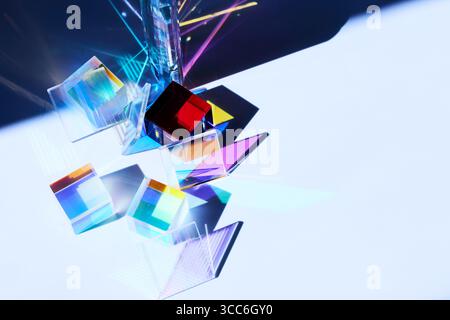 Prismatic Cubes and Light. Colorful glass cubes casting vibrant reflections in a minimalist setting. Stock Photo