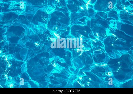 Blue water surface with glare and ripples. Top view Stock Photo