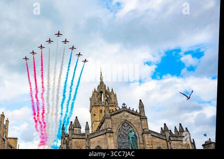 Red Arrows flypast above St. Gilles Cathedral on the High Street, Edinburgh. A display for the Royal Edinburgh Military Tattoo. Stock Photo