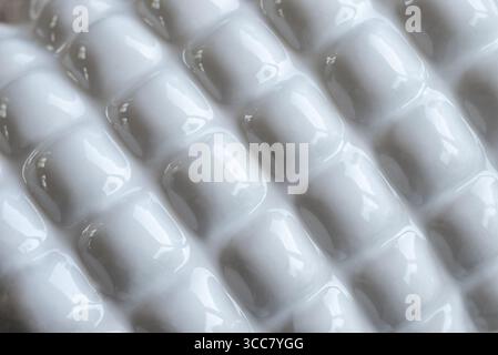Shiny and reflective white ceramic object with 3D effect projections. Abstract backgrounds Stock Photo